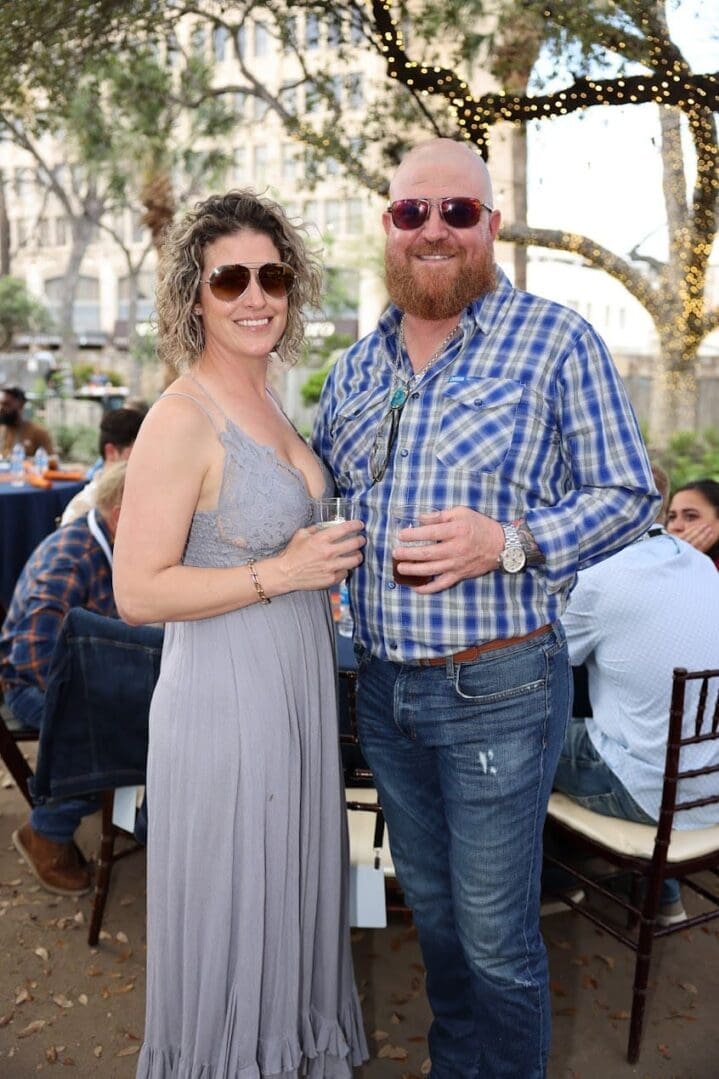 A man and woman standing next to each other.